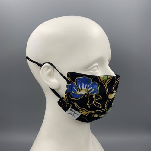 mannequin wearing floral patterned mask by Backyard Studios